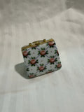 Hand-Painted Porcelain Handbag Trinket Box – Rose Lattice Pattern with Brass Frame